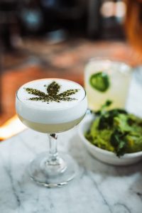 cocktail decorated with cannabis leaf