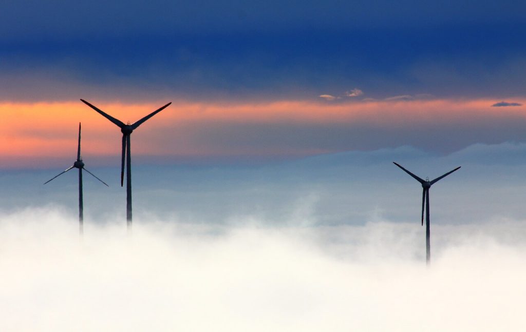 wind turbines in clouds at sunset